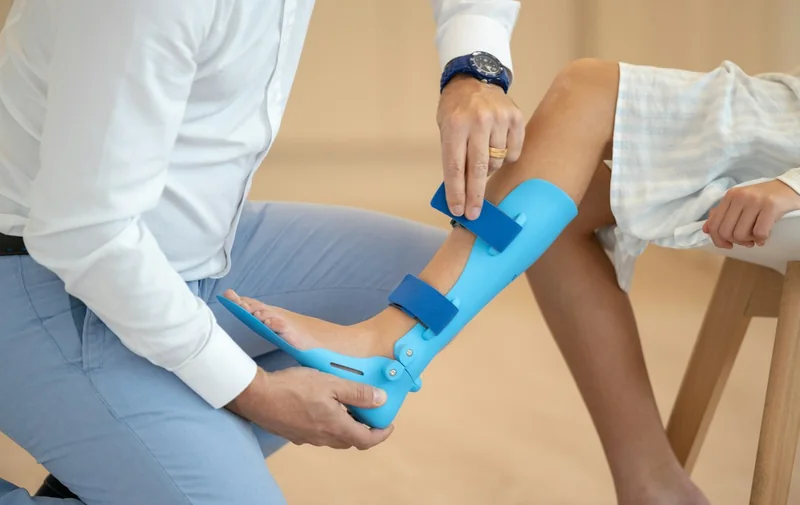 Fitting a leg brace after an injury
